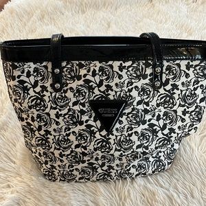 Guess shoulder bag black and cream flowers with black trim like new no scratches